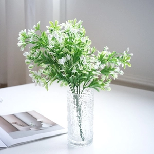Artificial white jasmine flower bouquet in textured glass vase for spring home decor