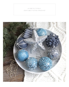 Blue and silver Christmas ornaments set with star tree topper in cozy holiday scene