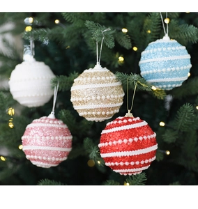 Close-up of 8cm glitter Christmas foam balls with pearl stripes on a decorated tree