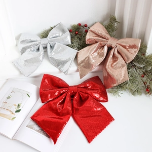 Glittery Christmas bow set in red, silver, and gold with sequins for tree decoration