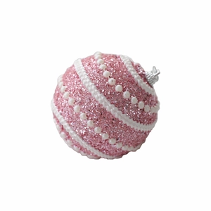 Pink Christmas ornament with glitter surface, white wave trim and pearls on a white background