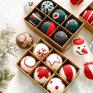 Handmade wool felt Christmas ornaments set in craft box featuring snowman and snowflakes
