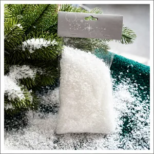 Artificial white snowflakes in retail packaging for Christmas tree decoration photography