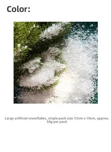 Macro detail of artificial white snowflakes on green pine needles for Christmas decor