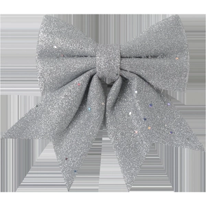 Close-up of a silver glitter bow ornament with colorful sequins for Christmas tree decor