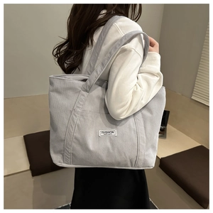 Light blue corduroy tote bag showing large capacity design and soft fabric texture