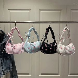 Floral print underarm bag with pleated handle and ribbon detail in four colors