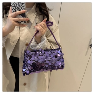 Detail of purple sequin baguette bag with adjustable shoulder strap for party wear