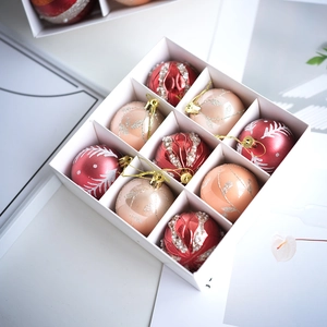 Nine-piece festive Christmas ball set in deep red and champagne gold for tree decor