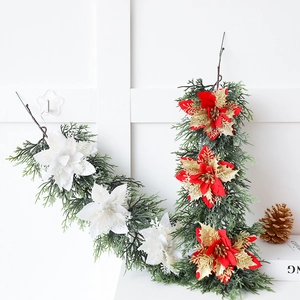 Artificial Christmas garland featuring white poinsettias and golden pine cones decoration