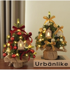 Detailed close-up of mini PE Christmas trees with LED lights and burlap wrapped bases