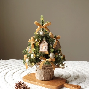 Mini PE artificial Christmas tree with gold bows, LED wooden house and burlap base