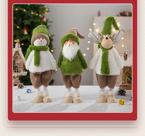 Three plush Christmas figurines including snowman, gnome and deer on a festive snowy base