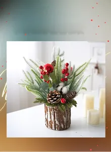 Close-up of artificial mini Christmas tree with snow, berries and pine cones in wood bucket