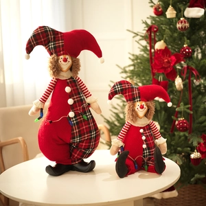 Christmas clown plush doll set with red knit and checkered pattern on white table