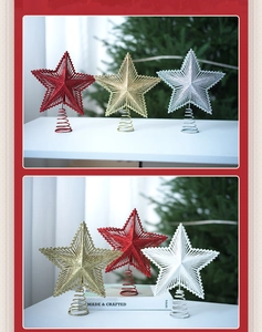 Detail of glitter Christmas tree star toppers in red, gold, and silver with spiral bases