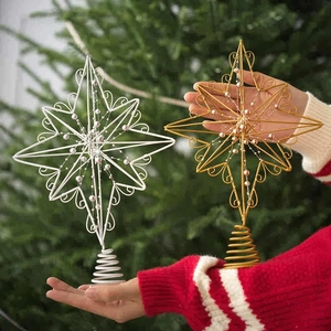 Set of gold and silver wrought iron star Christmas tree toppers with decorative beads
