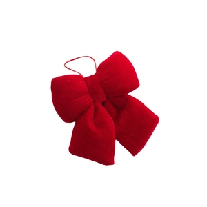 Red velvet Christmas bow ornament with hanging string for festive tree decorations