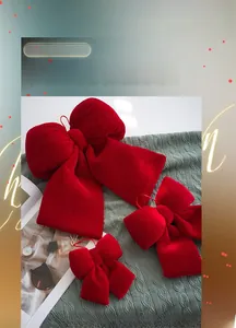 Three sizes of red velvet bows for Christmas tree decoration with elegant gold lanyards