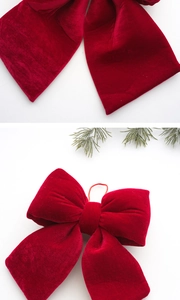 Detail of red velvet Christmas bow featuring plush texture and festive hanging loop