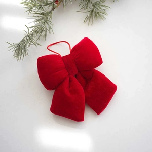 Red velvet Christmas bow ornament with hanging loop for holiday tree decoration