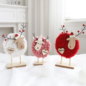 Three wool felt Christmas reindeer ornaments with XMAS wood hearts and wooden bases