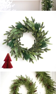 Macro detail of layered forest-style PE Christmas wreath with pine needles and fern leaves