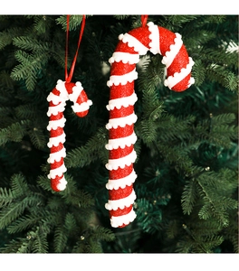 Close-up of glittery red and white candy cane Christmas tree hanging decorations