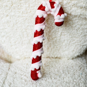 Sparkly red glitter candy cane Christmas tree ornament with white fuzzy spiral ribbon