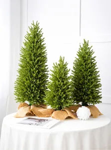 Three-piece set of mini artificial Christmas trees with rustic burlap wrapped bases