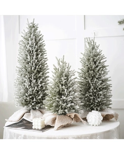 Three-piece set of mini flocked Christmas trees with rustic linen bases for holiday decor