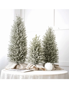 Three-piece flocked artificial Christmas trees with burlap bases for winter table decor