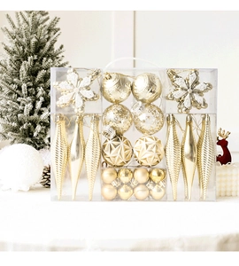 Detailed view of assorted gold Christmas ornaments in a gift box with a clear handle