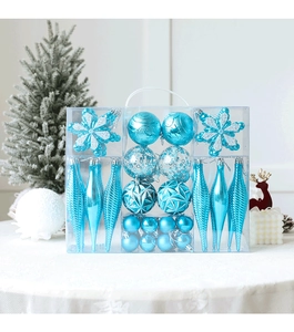 Blue Christmas ornaments set with snowflake and finial shapes in a clear display box