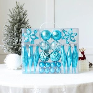 Sky blue Christmas ornament set with snowflakes and baubles in a clear gift box