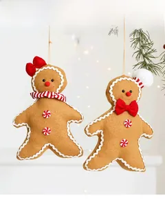Close-up of plush gingerbread man Christmas tree ornaments with soft felt fabric textures