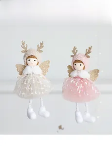 Detail showing two angel doll ornaments with sequin mesh skirts and golden antlers