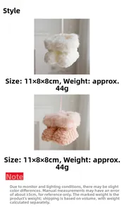 Detail of plush Christmas boot ornaments in pink and white with quilted texture