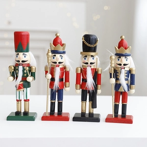 Detailed view of four colorful wooden nutcracker soldiers with drums and scepters
