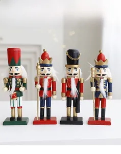 Detailed macro shot of four hand-painted wooden Nutcracker soldier figurines on white table