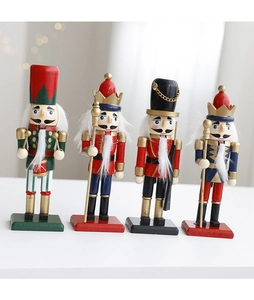 Detail of four handcrafted wooden nutcracker figures with festive bokeh background lighting