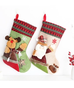 Detailed view of Christmas stockings with Santa and reindeer designs on white background