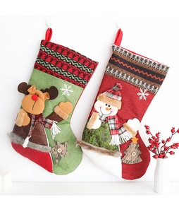 Detailed close-up of 3D reindeer and snowman holiday stockings with hanging loops