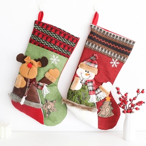 Rustic Christmas stockings with reindeer and snowman plush figures for holiday decoration