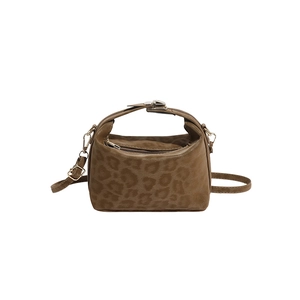 Minimalist leopard print crossbody bag with gold zippers and adjustable shoulder straps
