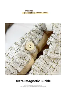Detailaufnahme des goldenen Magnetverschlusses an einer weißen Tweed-Handtasche