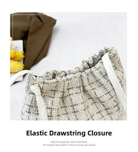Nahaufnahme des Kordelzugs einer Tweed-Beuteltasche mit Goldakzenten und Lederriemen