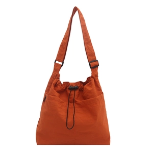 Bright orange large nylon tote bag with drawstring closure and two front pockets