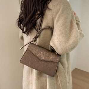 Women's 2025 brown metallic textured flap crossbody bag with knotted handle detail