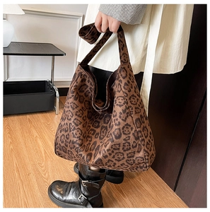 Detailed view of large leopard print hobo bag with wide strap for stylish casual look